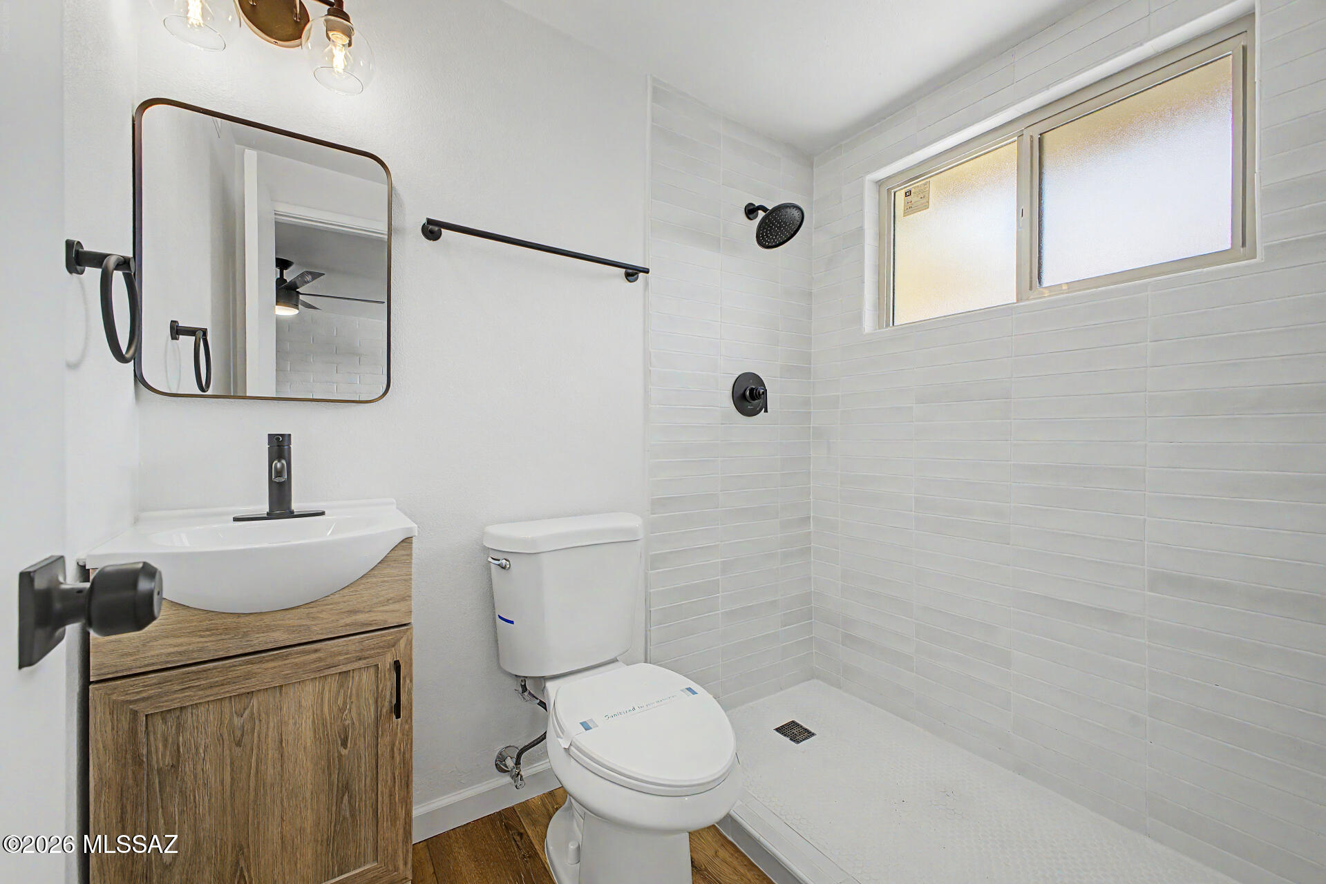 3402 South Kolb Road Tucson, AZ 85730 - Photo 15 of 32 a white toilet sitting next to a bathroom sink