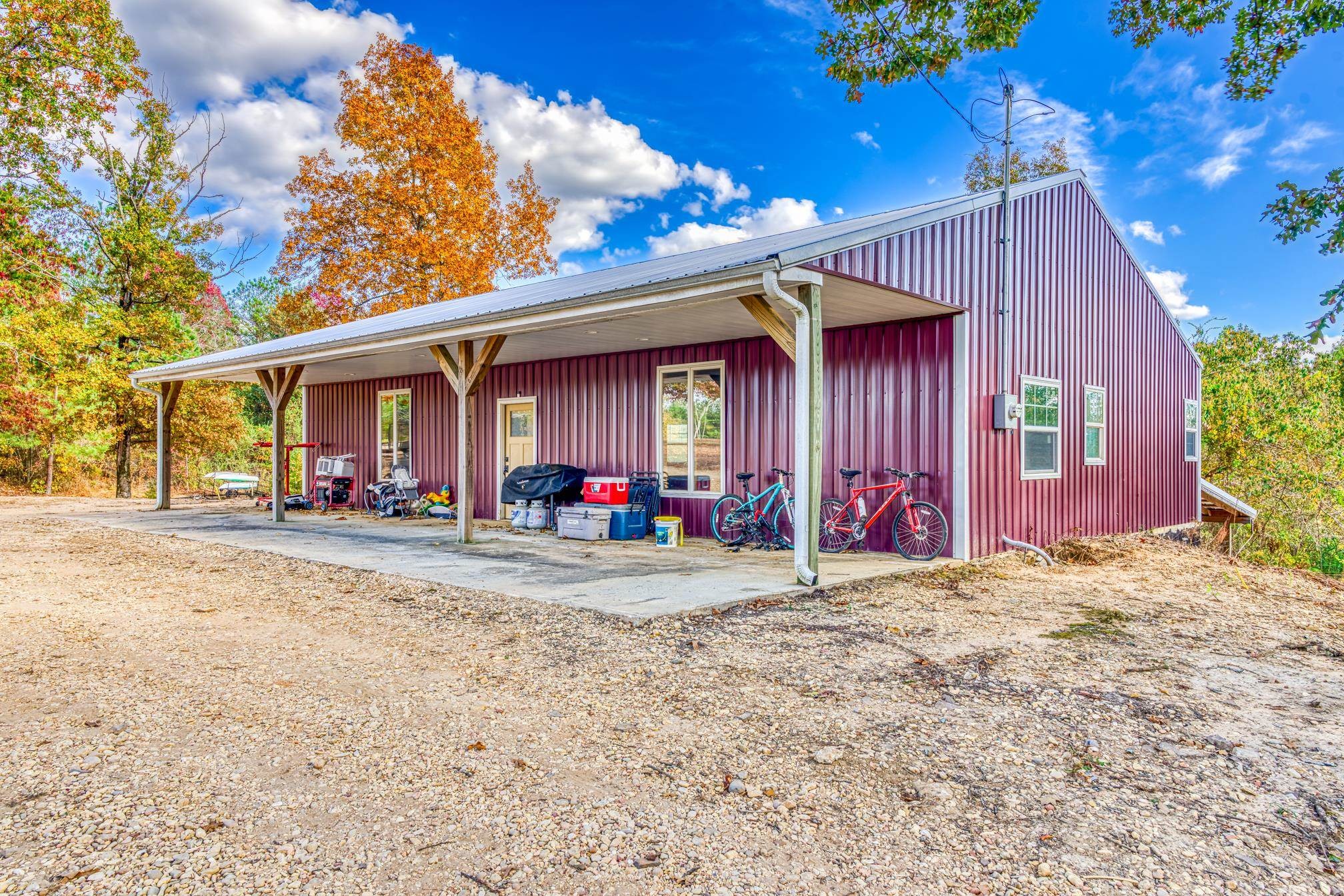 234 Fire Creek Cut Road Guin, AL 35563 - Photo 5 of 12 a view of a house with backyard and sitting area