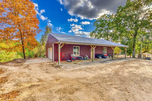 a view of a house with a yard and garage