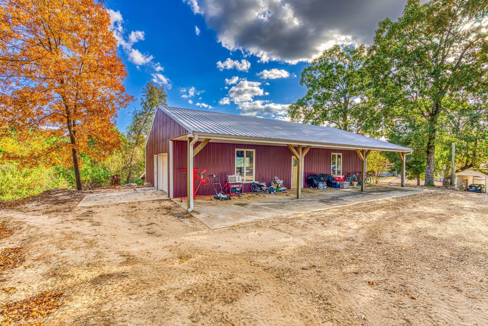 234 Fire Creek Cut Road Guin, AL 35563 - Photo 7 of 12 a view of a house with a yard and garage