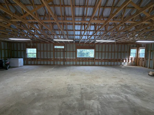 a view of an empty room with a wooden roof