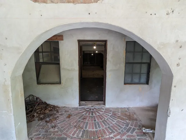 a view of a hallway to a bedroom