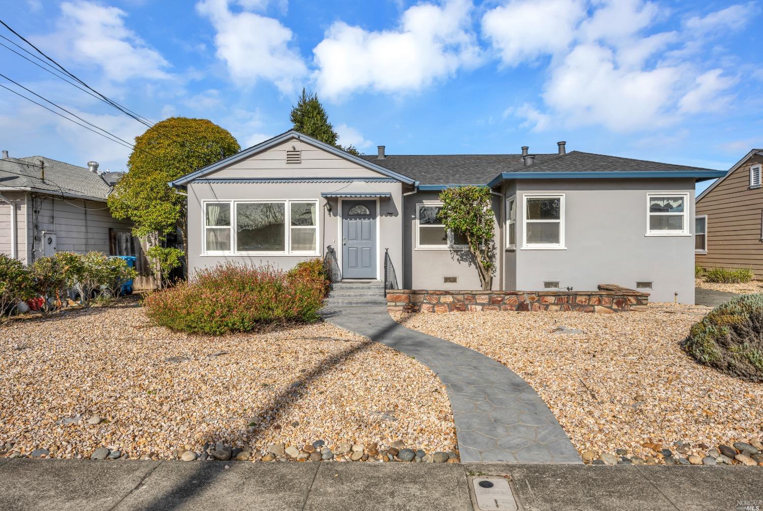 451 Flower Avenue Santa Rosa, CA 95404 - Photo 1 of 1 a front view of a house with a yard