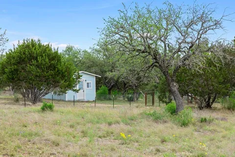a house view with a backyard space