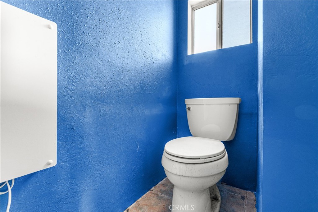 475 Fair Acres Landers, CA 92285 - Photo 13 of 19 a white toilet sitting next to a white wall