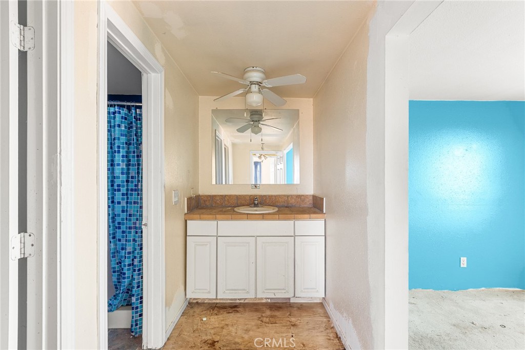 475 Fair Acres Landers, CA 92285 - Photo 9 of 19 a bathroom with a sink and a mirror