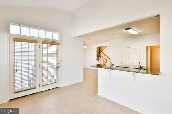 a view of an entryway with a floor to ceiling window