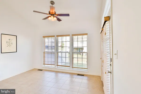 a kitchen with granite countertop stainless steel appliances a refrigerator a stove a sink a center island and a refrigerator
