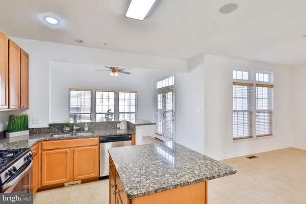 a stove top oven sitting inside of a kitchen
