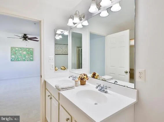 a white toilet sitting next to a bathroom sink