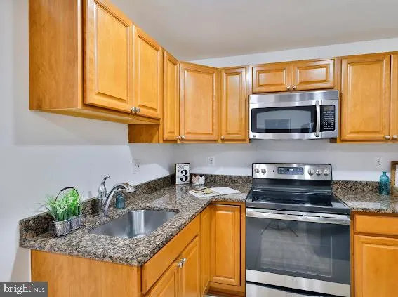 a car parked in front of a brick house