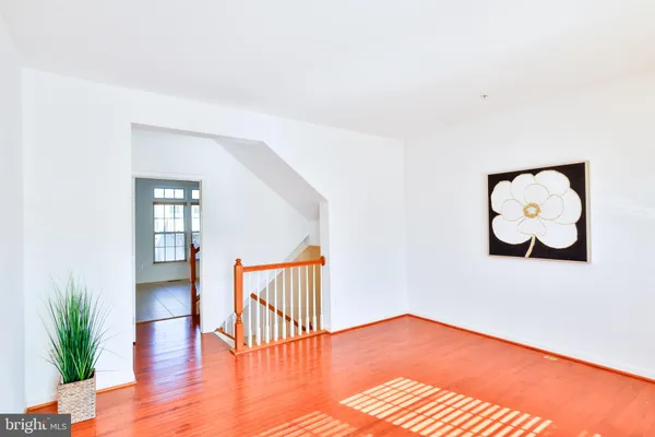 a view of an entryway with wooden floor