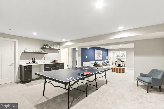 a bathroom with a double vanity sink toilet and shower