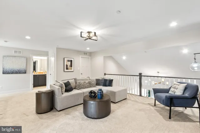 a living room with pool table and a pool table