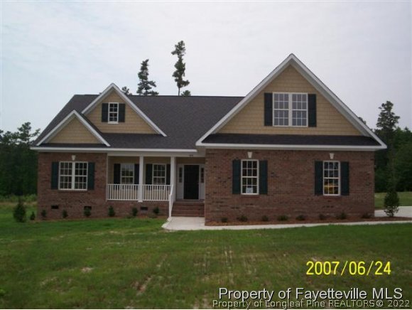 488 Booth Pond Road Raeford, NC 28376 - Photo 1 of 6 a front view of a house with a yard