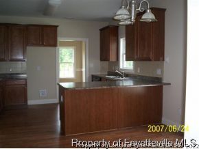 488 Booth Pond Road Raeford, NC 28376 - Photo 3 of 6 a view of a kitchen counter space and window