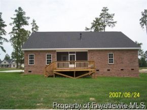 488 Booth Pond Road Raeford, NC 28376 - Photo 6 of 6 a backyard of a house with table and chairs