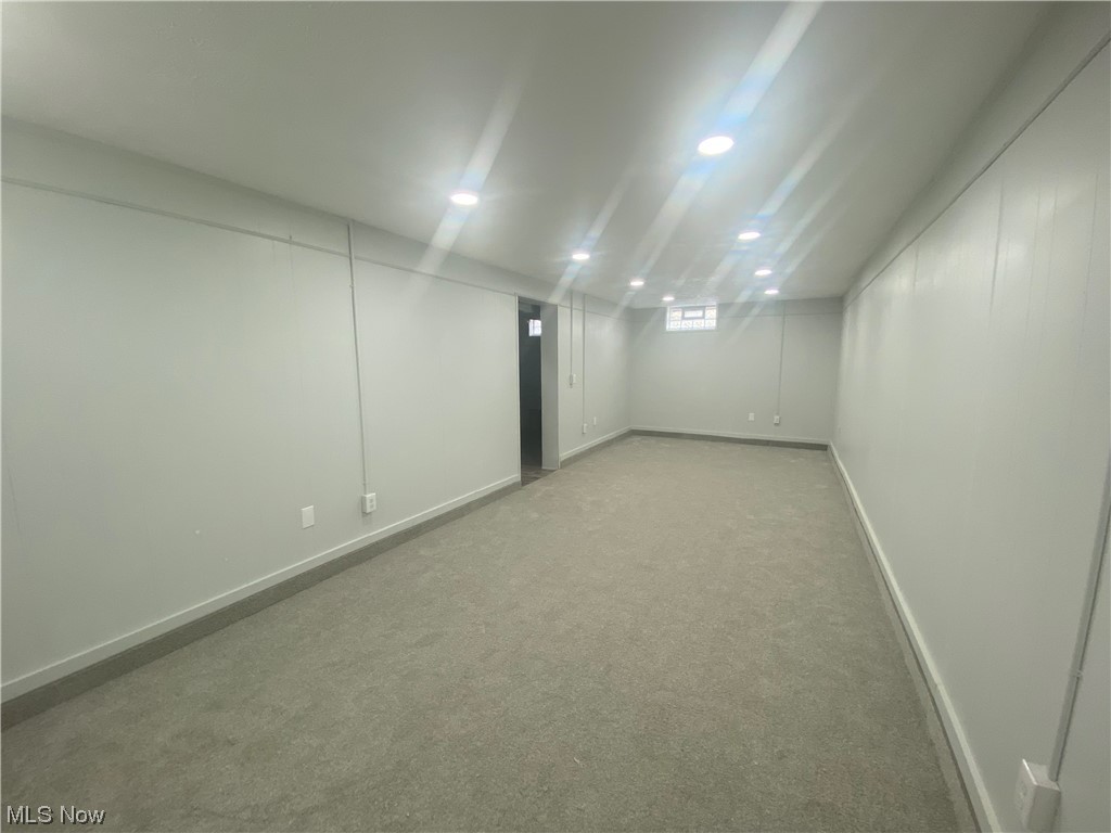 12913 Silver Road Cleveland, OH 44125 - Photo 19 of 23 Partially finished Basement with light carpet and recessed lighting