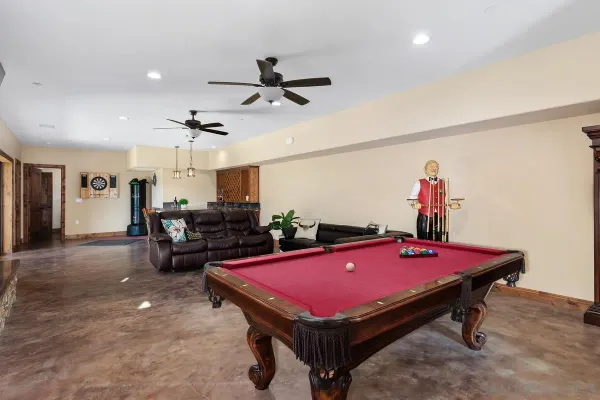 a room with pool table and a table