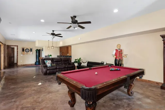 a room with pool table and a table
