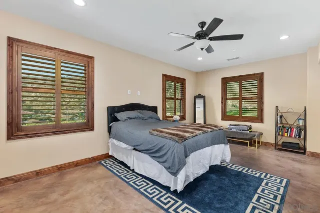 a bed room with a bed and a window