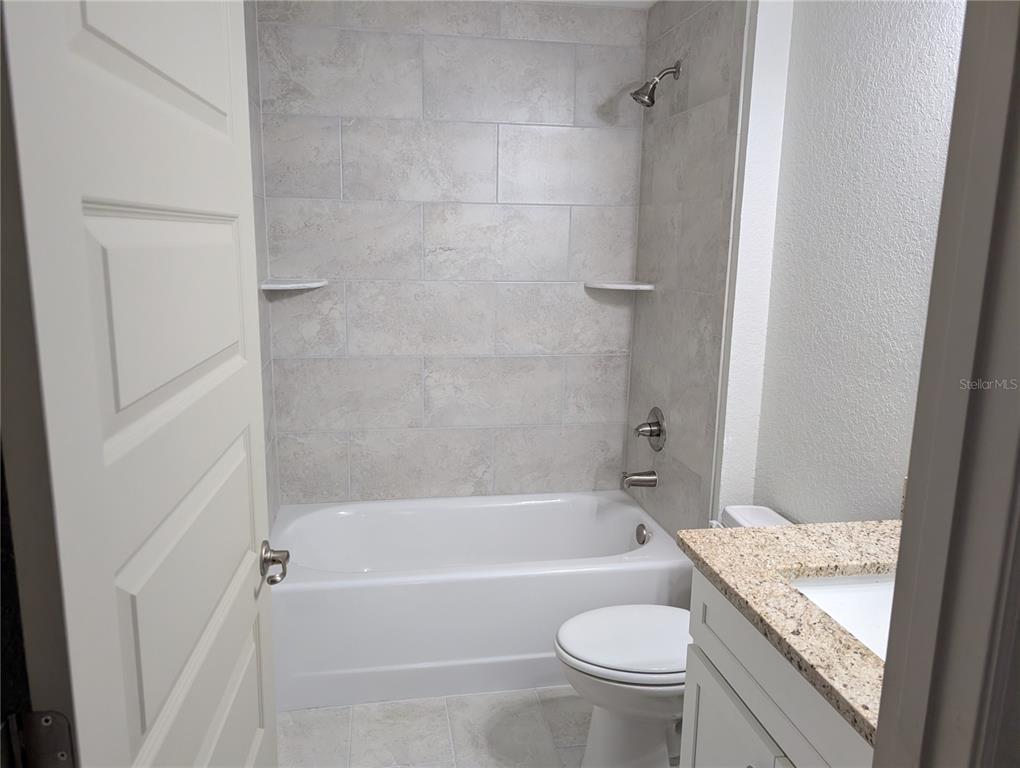 37 Fir Drive Trace Ocala, FL 34472 - Photo 17 of 31 a bath room with a toilet and a bath tub