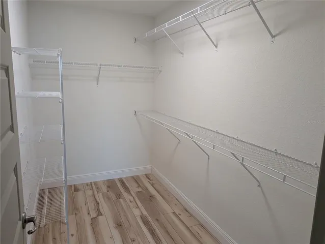 a view of a room with racks on the wall