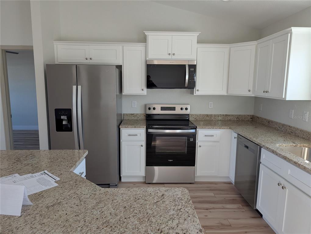 37 Fir Drive Trace Ocala, FL 34472 - Photo 9 of 31 a kitchen with stainless steel appliances a refrigerator stove and sink