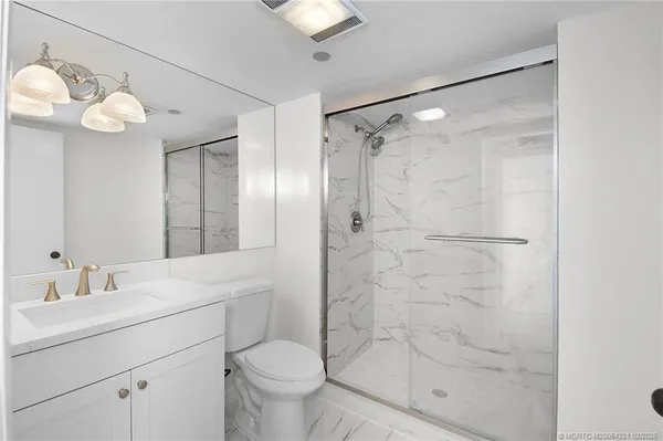 an empty room with sliding glass door and glass door