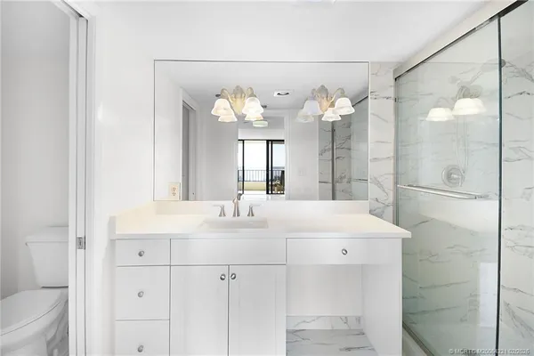 a view of a city with an ocean view