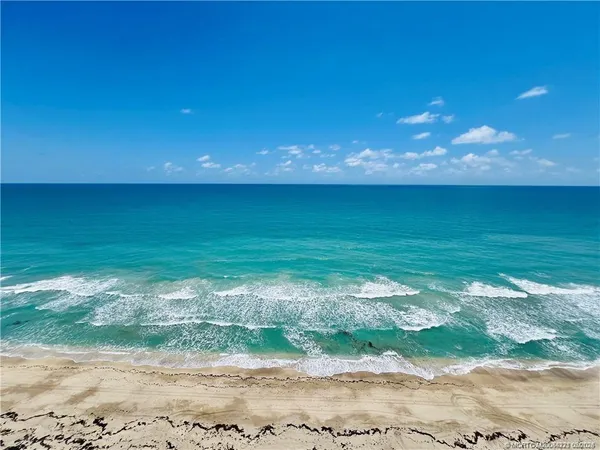 a view of a dining hall with furniture and wooden floor