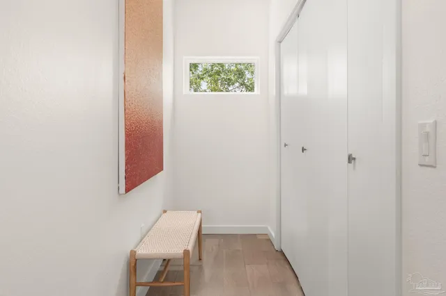 a view of room with window and hallway