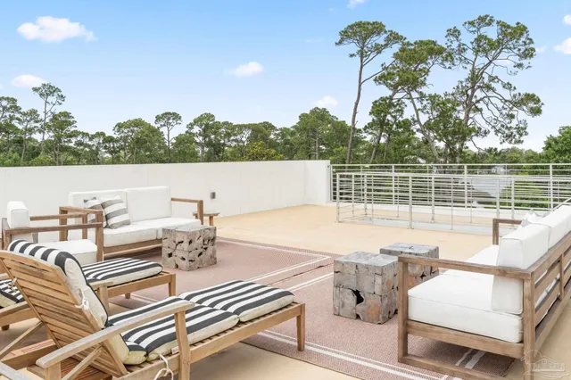 a view of a patio with couches table and chairs