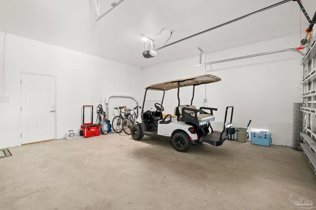 a view of a garage with parked cars