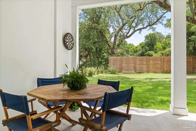 a view of an outdoor sitting area with furniture