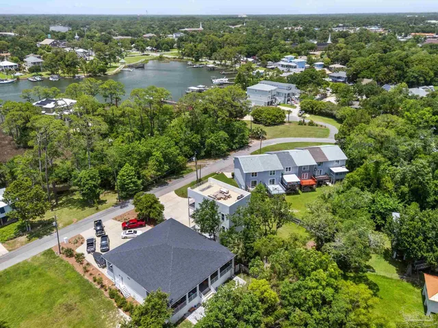 an aerial view of a house with a lake view