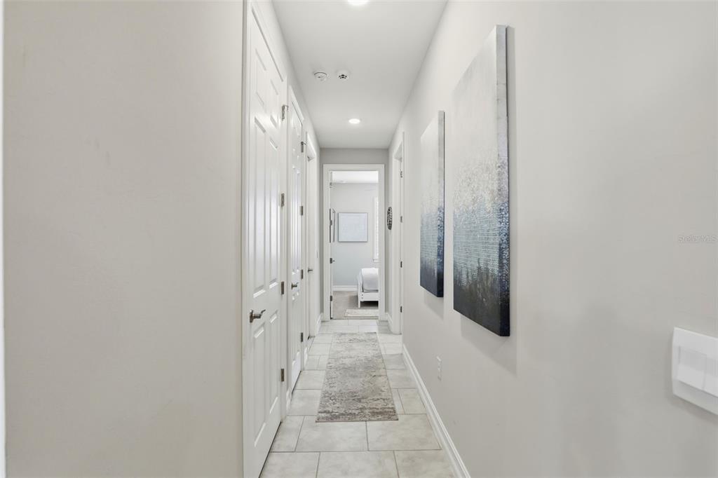 112 Ibiza Loop Venice, FL 34292 - Photo 12 of 35 a bathroom with a glass shower door and a mirror
