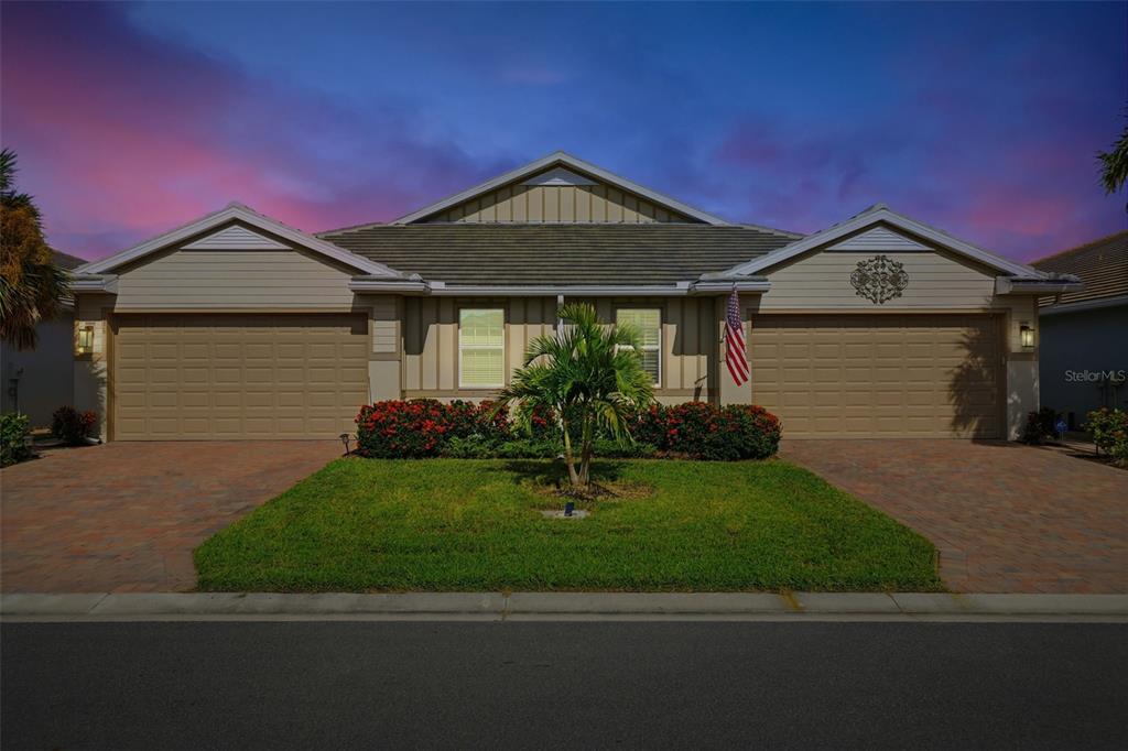 112 Ibiza Loop Venice, FL 34292 - Photo 29 of 35 a front view of a house with garden