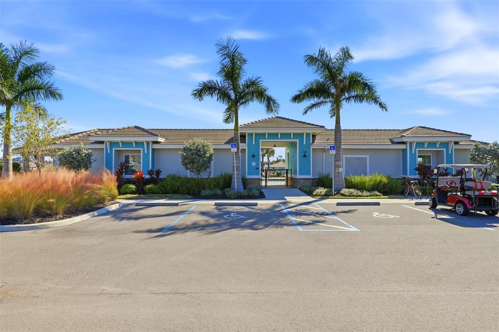 112 Ibiza Loop Venice, FL 34292 - Photo 31 of 35 front view of a house with a yard and palm trees