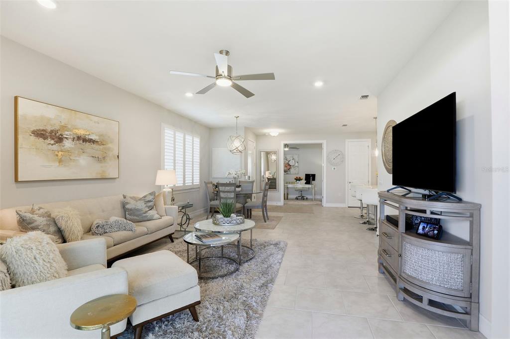 112 Ibiza Loop Venice, FL 34292 - Photo 5 of 35 a living room with furniture and a flat screen tv