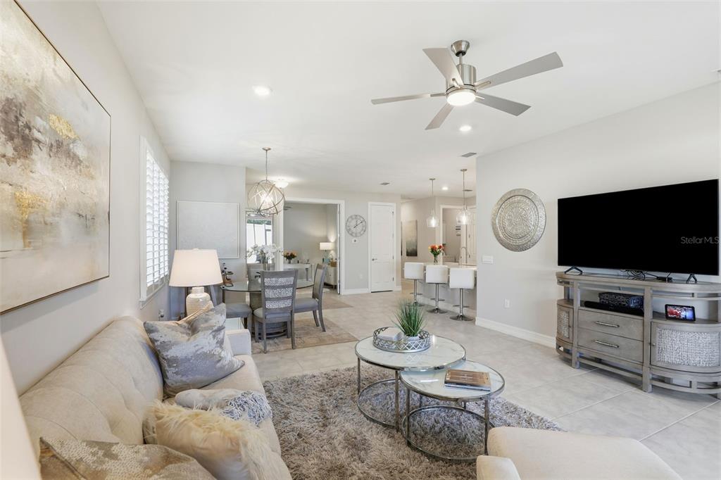 112 Ibiza Loop Venice, FL 34292 - Photo 6 of 35 a living room with furniture and a flat screen tv