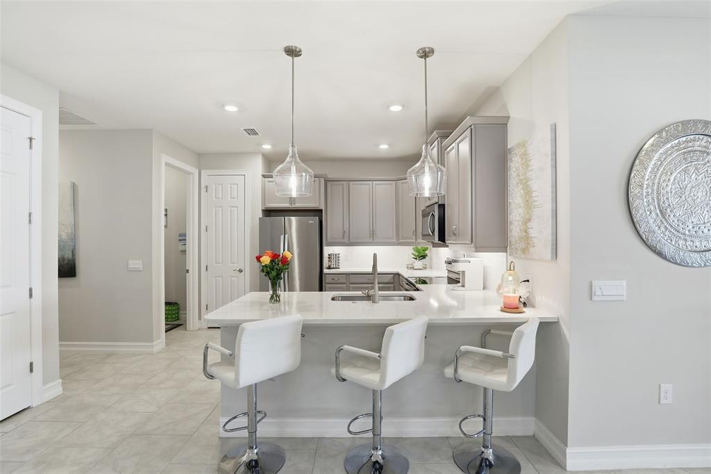 112 Ibiza Loop Venice, FL 34292 - Photo 8 of 35 a very nice looking dining room with a large mirror and furniture