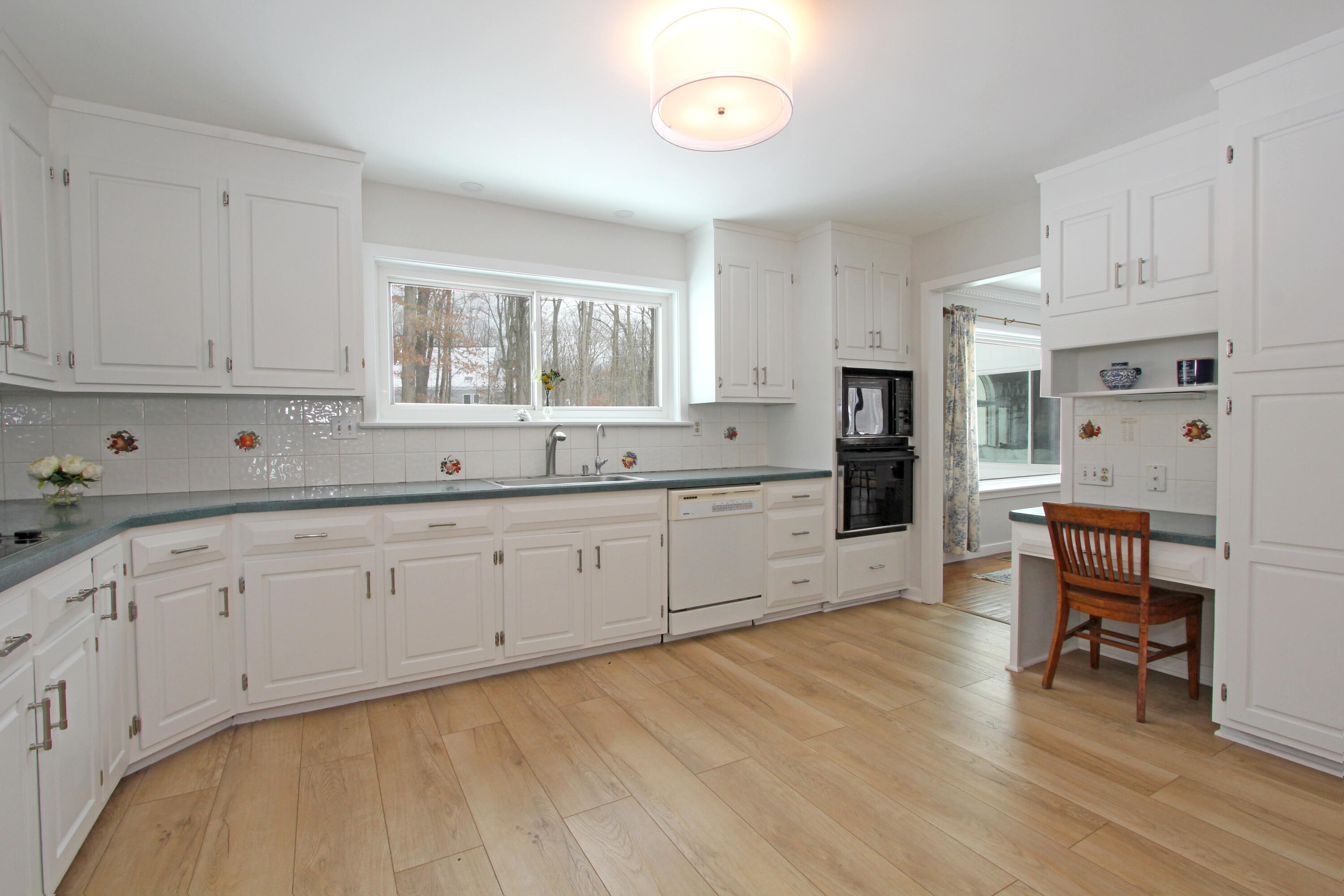 149 Journeys End Road Wilton, CT 06897 - Photo 12 of 30 a kitchen with cabinets a sink and white appliances