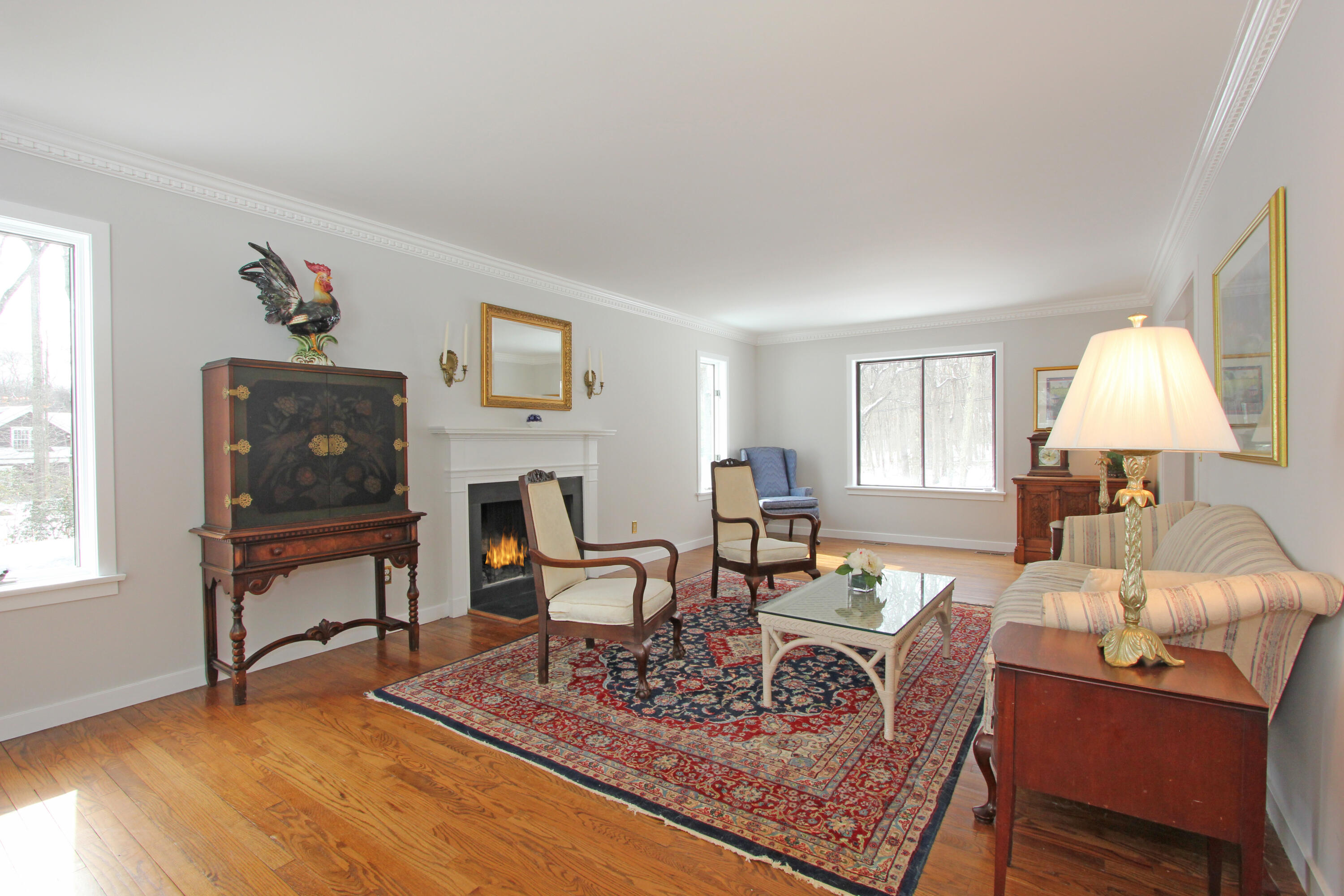 149 Journeys End Road Wilton, CT 06897 - Photo 6 of 30 a living room with furniture and a fireplace