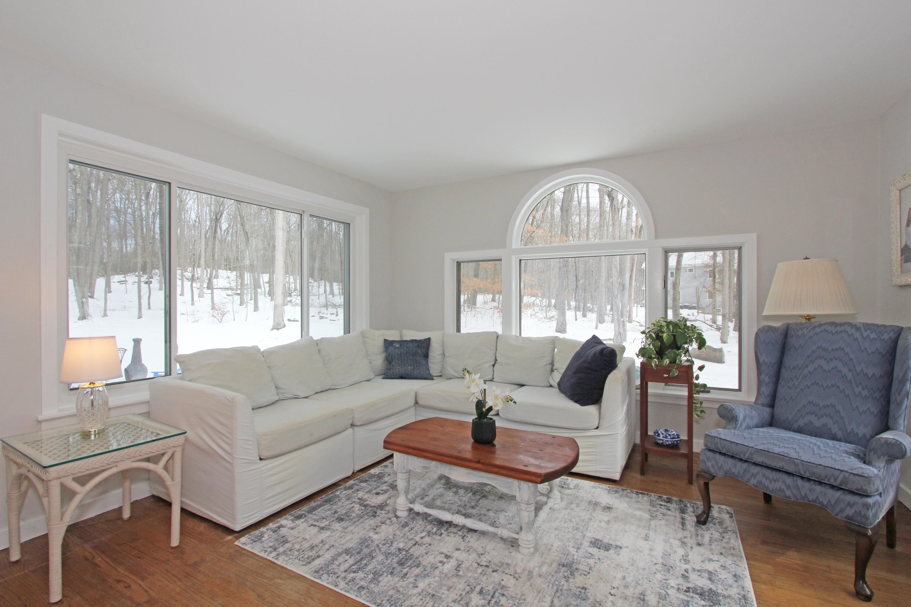 149 Journeys End Road Wilton, CT 06897 - Photo 8 of 30 a living room with furniture a large window and a table