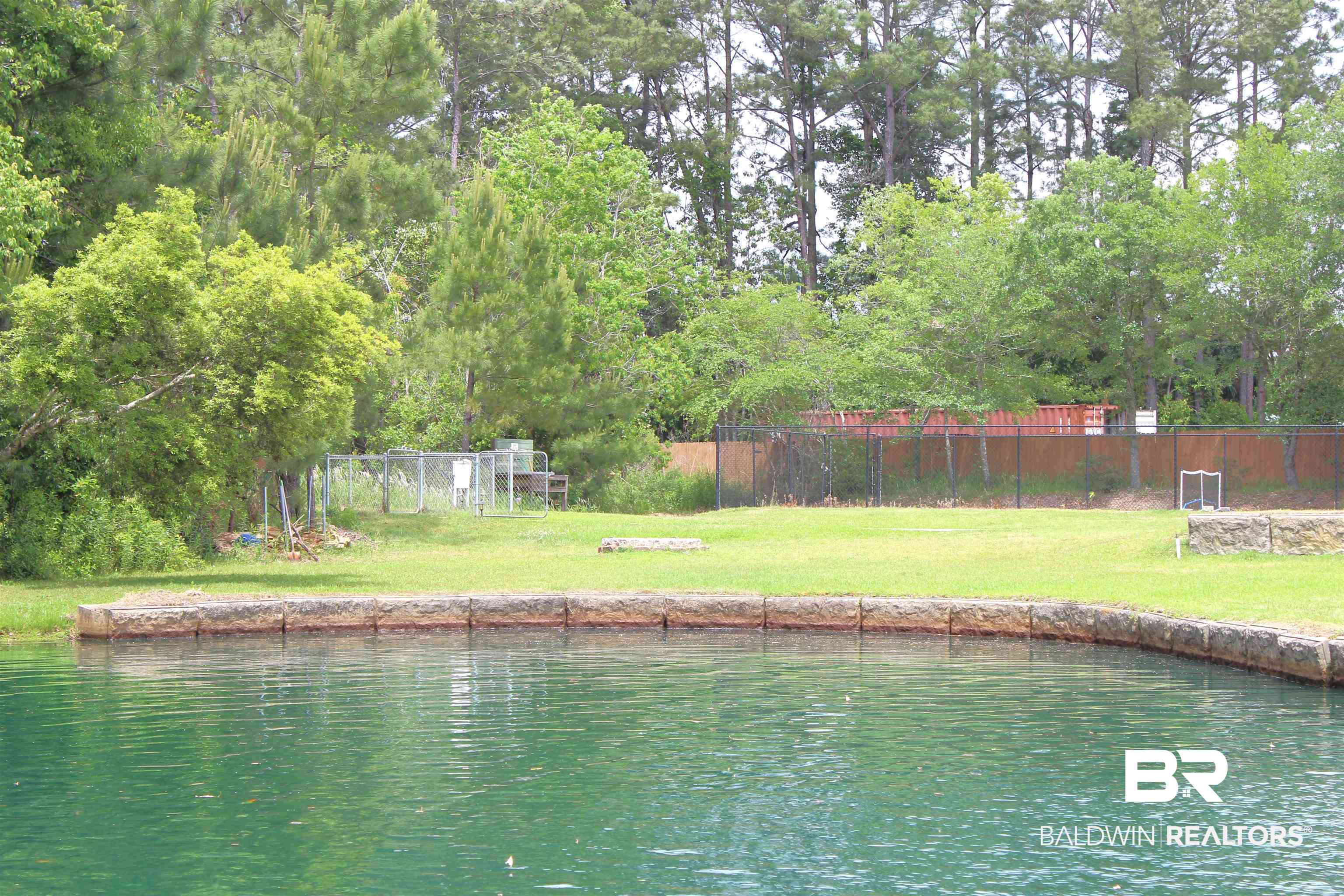 11869 Gateway Drive Elberta, AL 36530 - Photo 47 of 78 View of water feature with fence