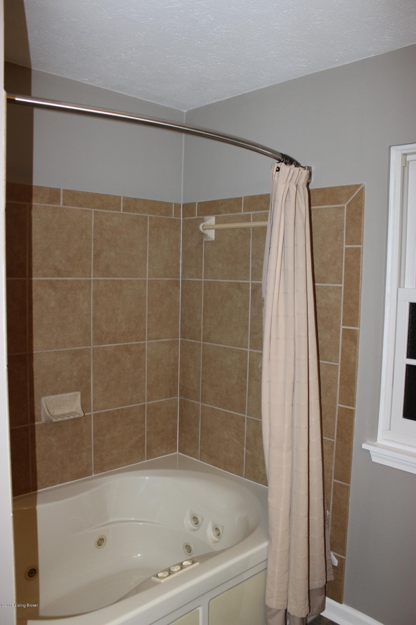 4306 Gaudet Road Jeffersontown, KY 40299 - Photo 12 of 16 Jacuzzi Tub with Tiled Walls