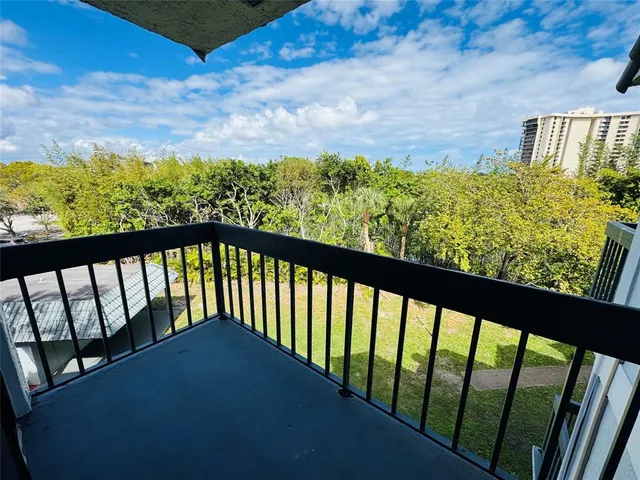 a swimming pool with buildings in the background