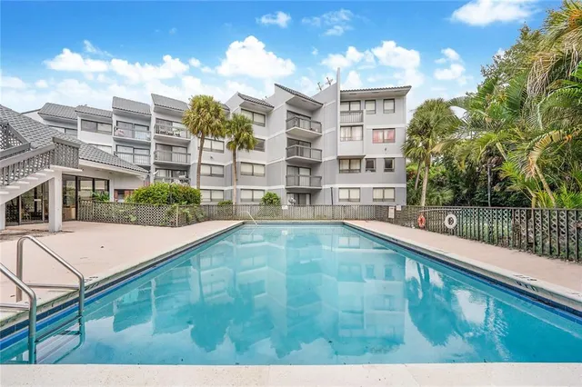 a view of a pool with a patio
