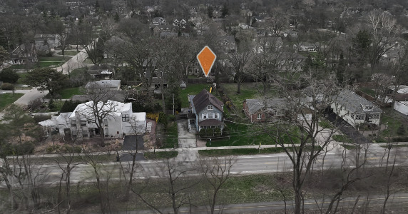 933 Harms Road Glenview, IL 60025 - Photo 12 of 25 a aerial view of a house with large trees and plants